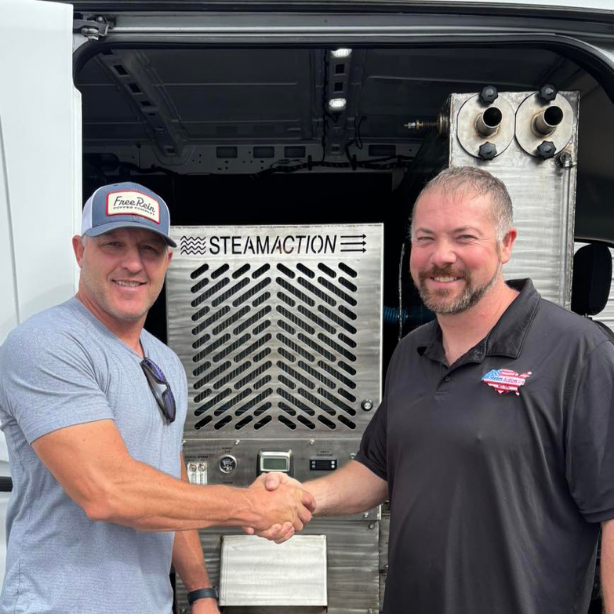 Handshake in front of a SteamAction unit